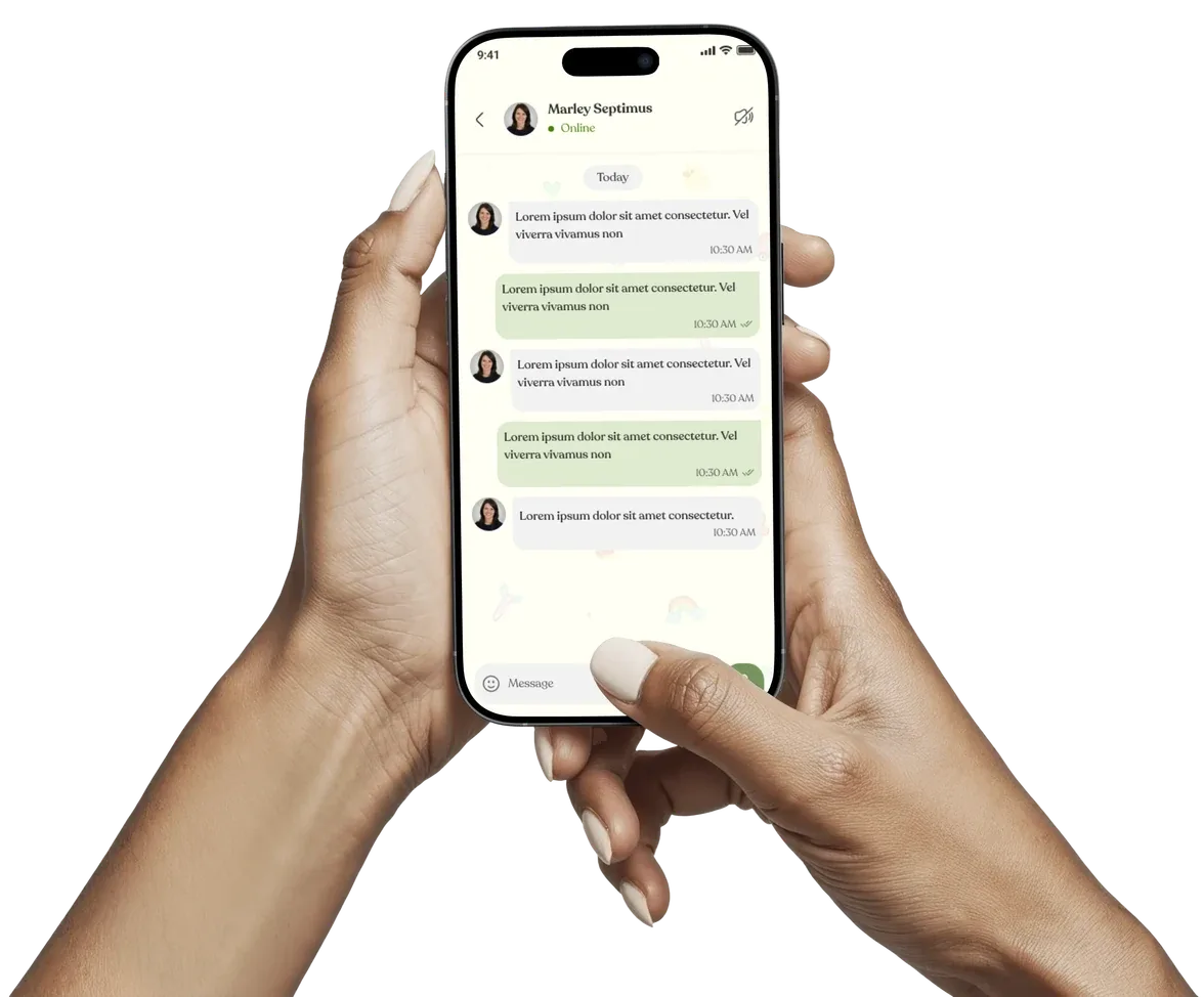 A parent holding a phone that shows a chat with the nursery